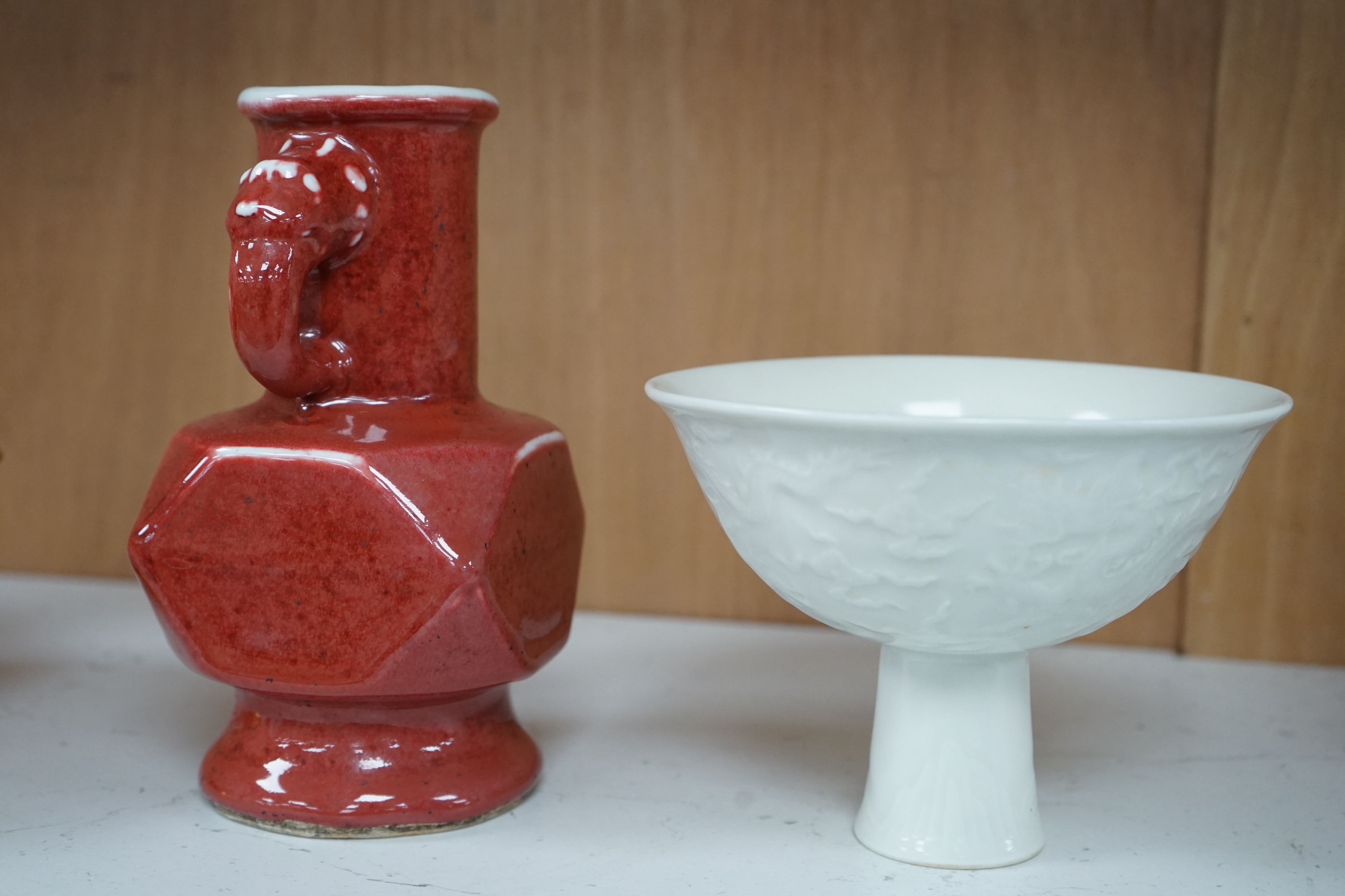 A Chinese red glazed elephant handled vase and a white glazed 'dragon' stem dish, tallest 18cm high. Condition - good